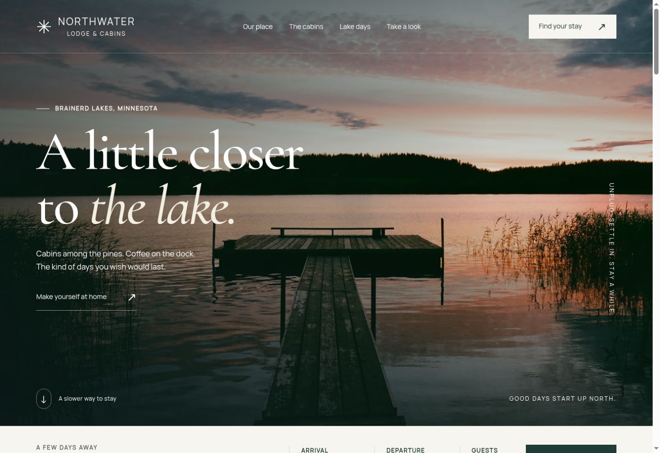Northwater Lodge homepage with a sunset over the lake, oversized serif lettering, and a direct link to explore the cabins.